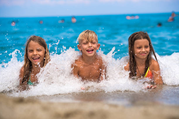 istock Three beauty kids on the beach 1035057442