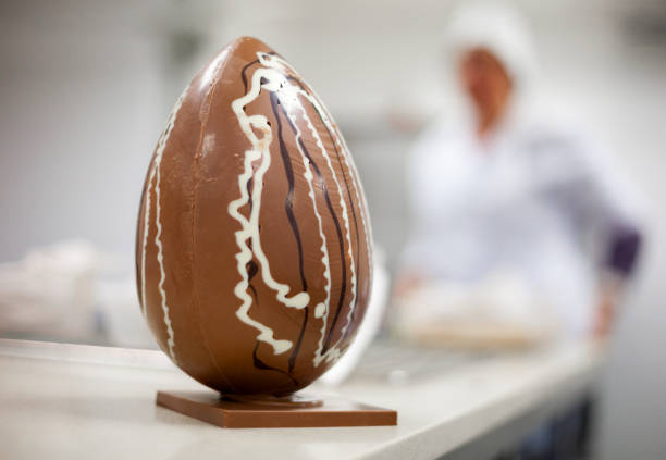 Making chocolate. Making chocolate easter eggs. Chocolate factory.