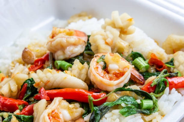 Fried basil shrimp with squid topped with rice