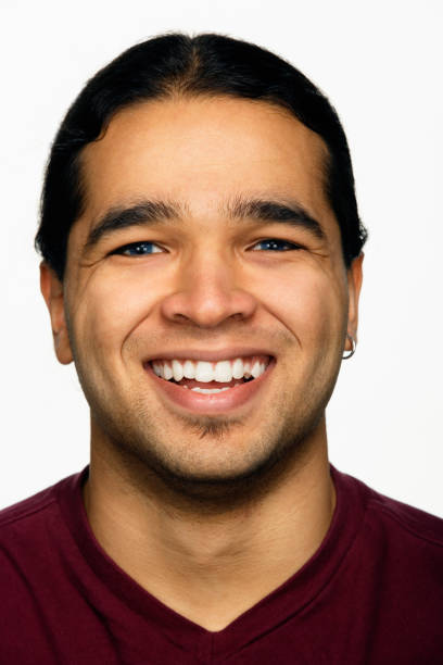 istock Close up studio shot of Hispanic man smiling 1035059250
