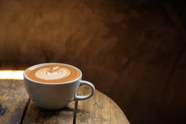 istock A cup of latte on wooden table 1035059410