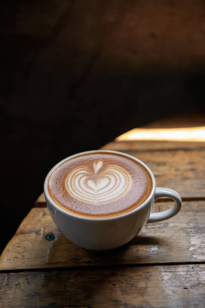 istock A cup of latte on wooden table 1035061542