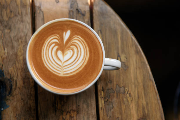 A cup of latte on wooden table