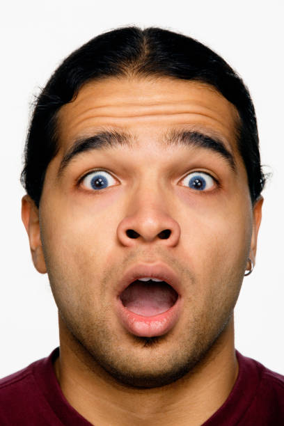 istock Close up studio shot of Hispanic man looking surprised 1035061648