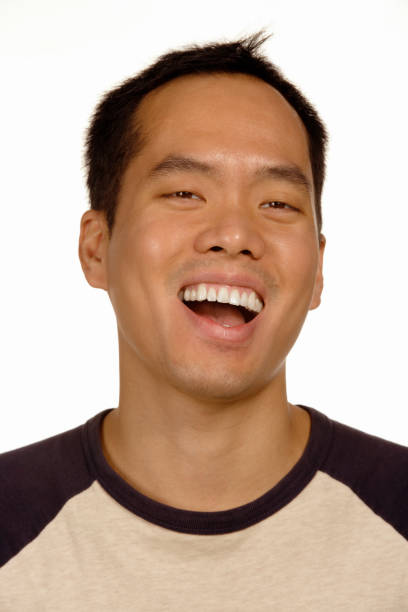 istock Close up studio shot of Asian man laughing 1035063836
