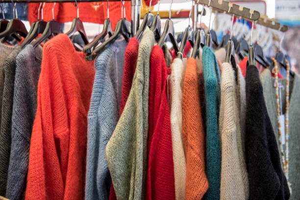 istock Hanger with new clothes on market 1035064102