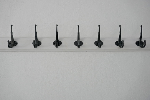 A row of black hooks