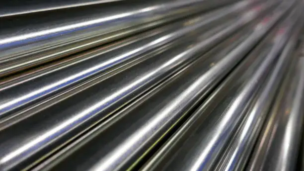 Photo of Metal bars, chrome plated and glossy,arranged diagonally