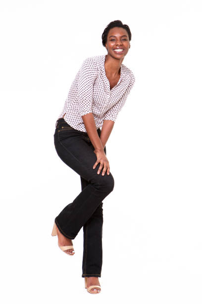 istock Full length beautiful young black woman leaning on white wall 1035065230