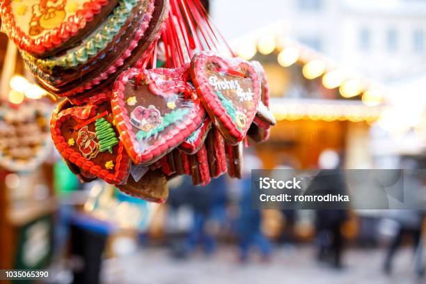 Gingerbread Hearts At German Christmas Market Nuremberg Munich Berlin Hamburg Xmas Market In Germany On Traditional Ginger Bread Cookies Written Happy Holiday Called Lebkuchenherz In German Stock Photo - Download Image Now