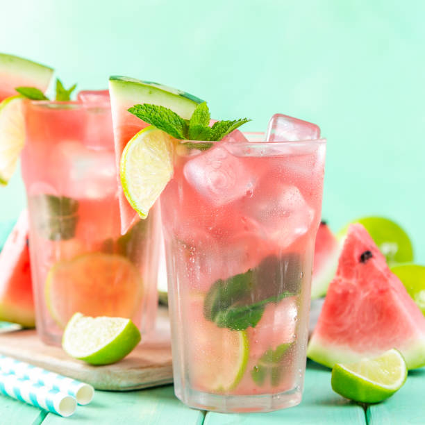 istock Watermelon lemonade with lime and mint, wood background 1035068640