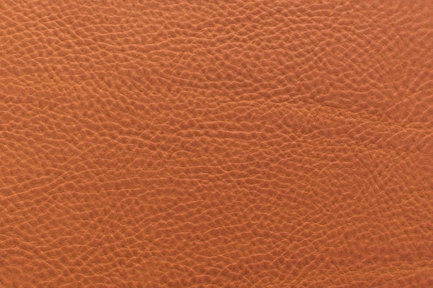istock Orange-brown grainy, heavy grain calf cow leather texture and background. 1035072794