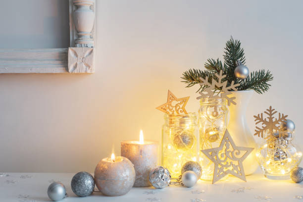 istock Christmas decoration with candles on background  white wall 1035074030