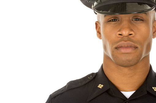 Studio shot of African male police officer