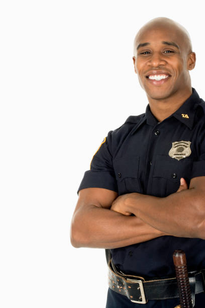 studio shot of african male police officer smiling - studio shot african descent minority looking at camera imagens e fotografias de stock