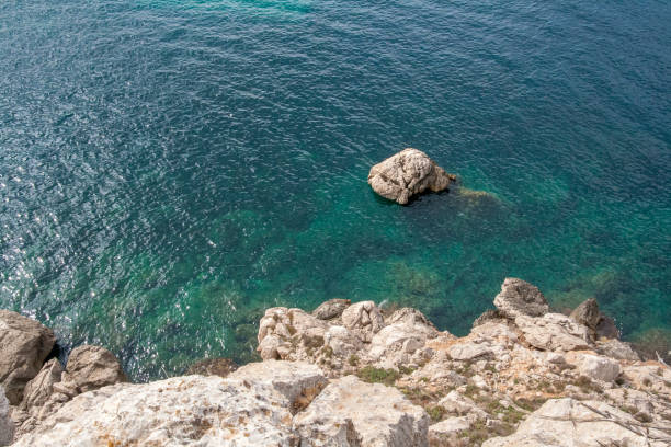istock Rock in the sea 1035078336
