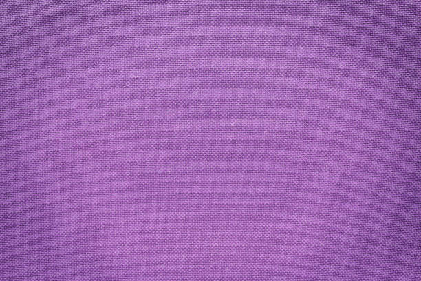 istock Royal purple woven fabric for graphic design and raw texture. 1035078542