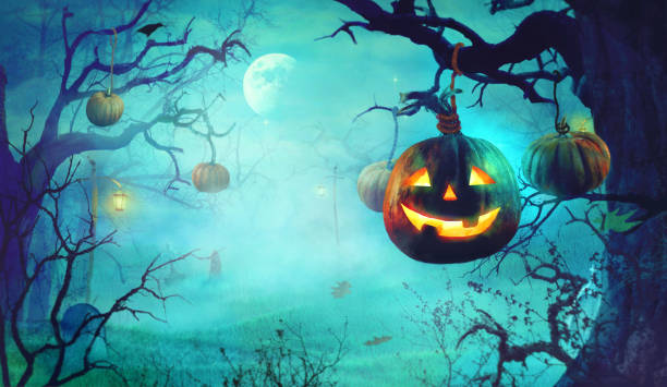 istock Halloween theme with pumpkins and dark forest. Spooky Halloween 1035086090