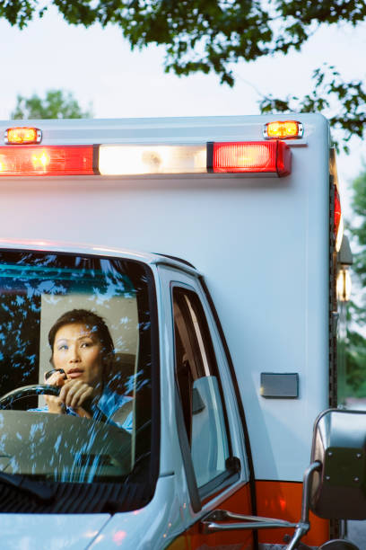 asiatische frauen sanitäter fahren krankenwagen - people traveling flash stock-fotos und bilder