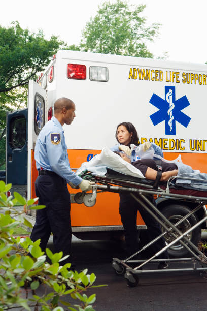 istock Paramedics putting woman into ambulance 1035099652