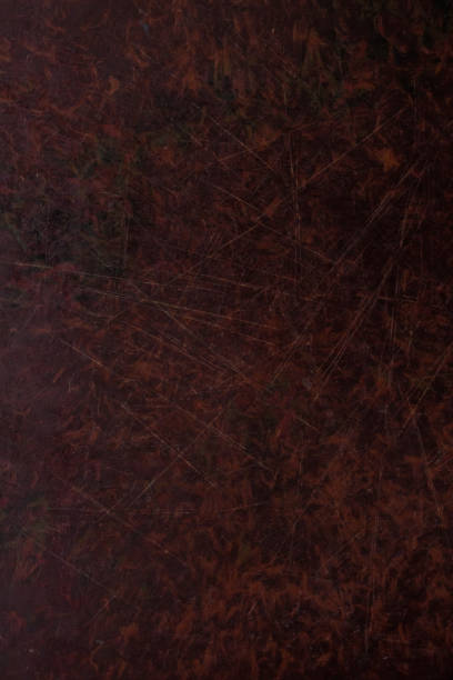istock Old dark brown wooden background with scratches. Table texture. 1035100880