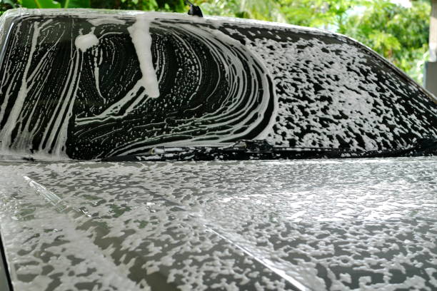 istock Foam on the floor, black car 1035103744