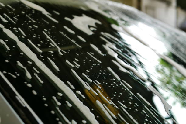 istock Foam on the floor, black car 1035103758