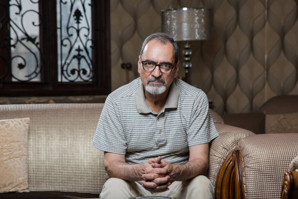 Sad senior man - Stock image Men, Sitting, Adult, Adults Only, Caucasian Ethnicity gloomy mood stock pictures, royalty-free photos & images