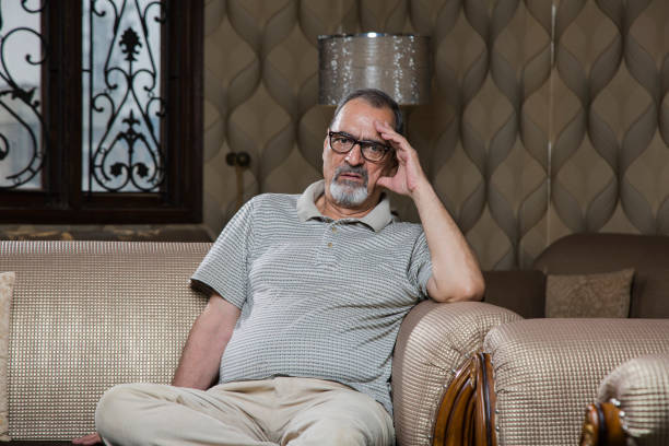 I have a great headache - Stock image Headache, Hand, Human Hand, Living Room, Medical Condition old man depressed stock pictures, royalty-free photos & images