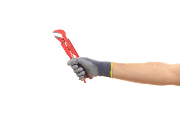 istock Hand holding a pipe wrench on white background 1035108470