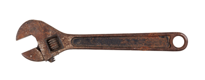 Old rusty wrench isolated on white background, top view