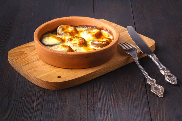 Juicy Mushrooms baked with cheese on table