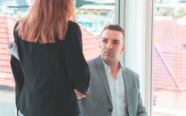 istock business man with confidence handshake with partner 1035114776