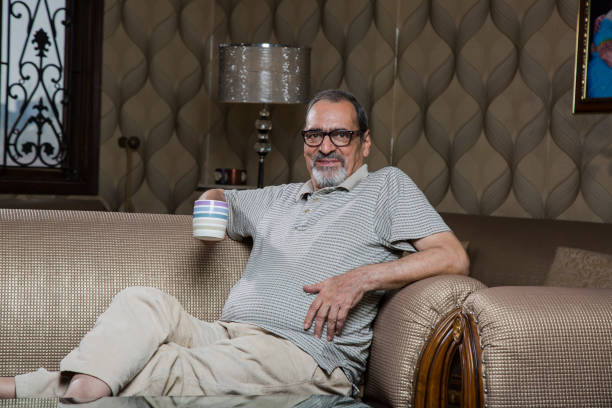 istock Senior man drinking coffee or tea - Stock image 1035115398