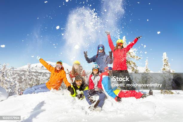Happy Skiers And Snowboarders Winter Vacations Stock Photo - Download Image Now - Skiing, Ski, Family