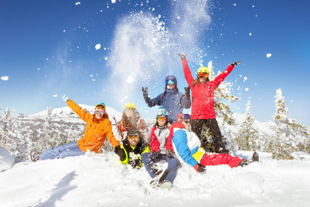 happy skiers and snowboarders winter vacations - skiing snow sport mountain imagens e fotografias de stock