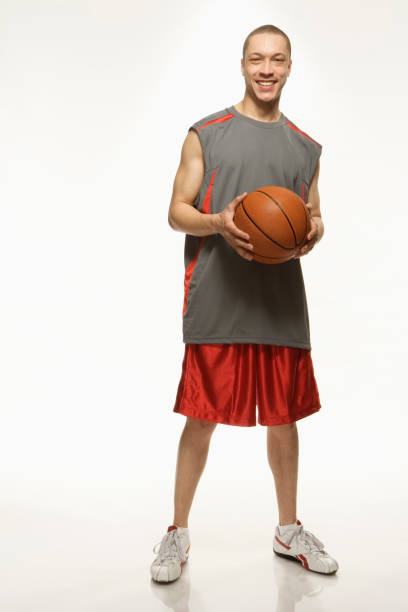 istock Mixed Race man holding basketball 1035118474