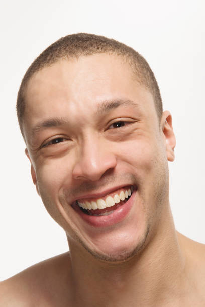 Close up of Mixed Race man laughing Close up of Mixed Race man laughing pale complexion stock pictures, royalty-free photos & images