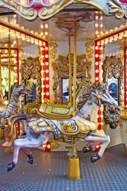istock Old fashioned french carousel with horses 1035123782
