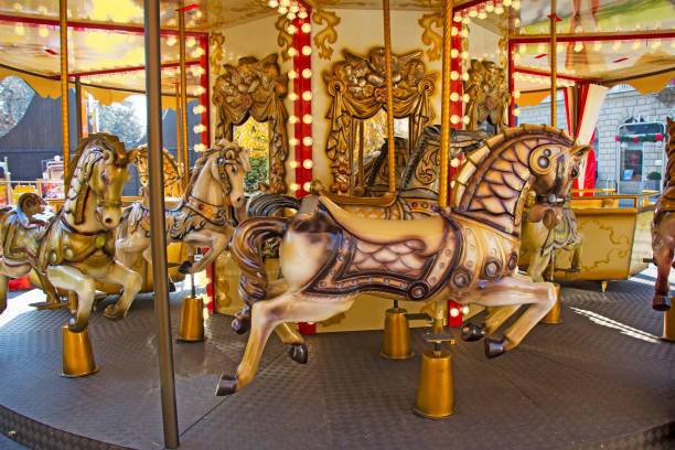 istock Old fashioned french carousel with horses 1035123894