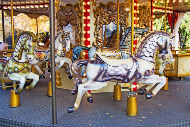 istock Old fashioned french carousel with horses 1035123980