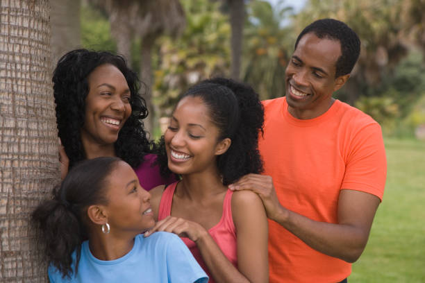 istock African family next to tree 1035124356