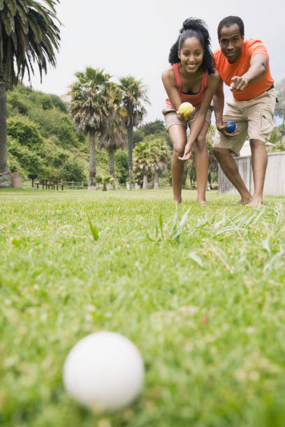 African couple playing bocci ball