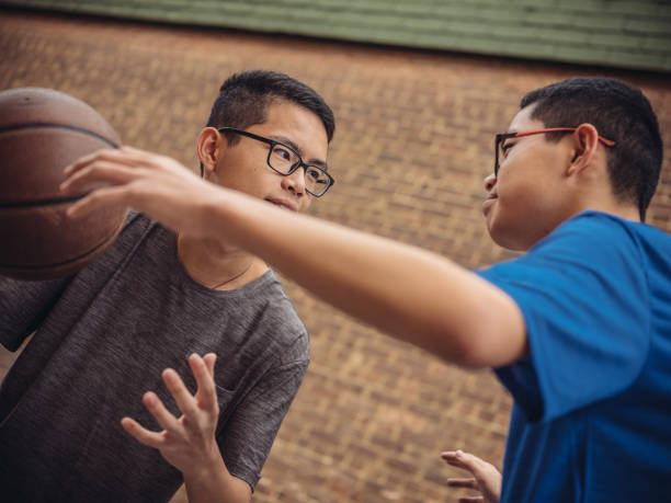 istock Twins at basketball 1035127064