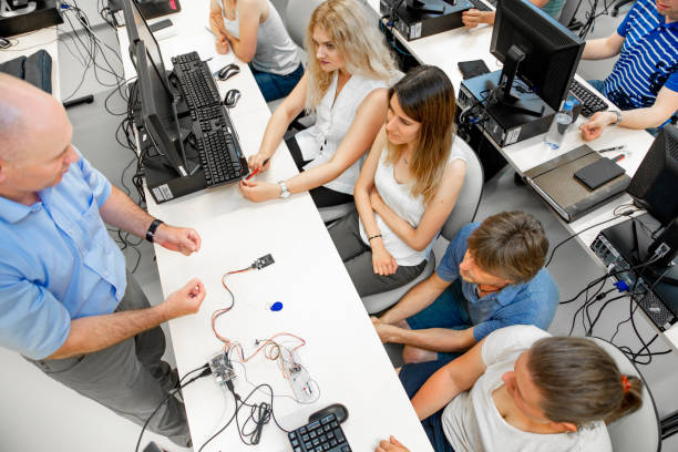istock Adult Students Listening to Professor Explaining About Computer Cables 1035127298