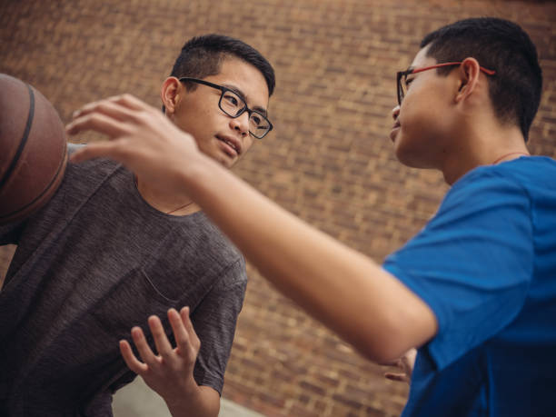 istock Twins at basketball 1035127438