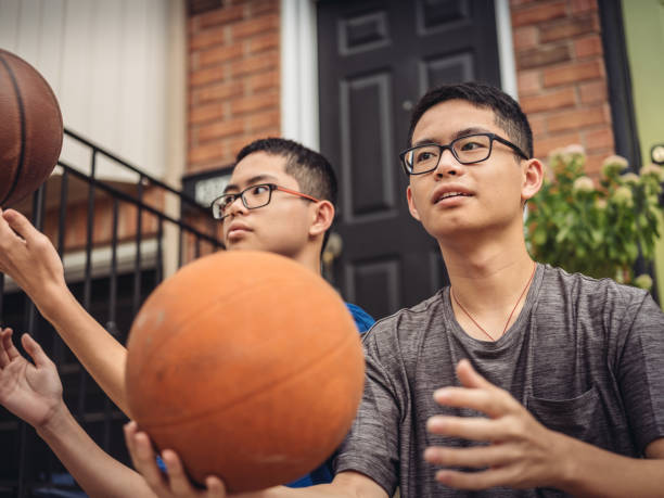 istock Twins at basketball 1035127584