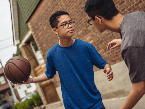 istock Twins at basketball 1035128052