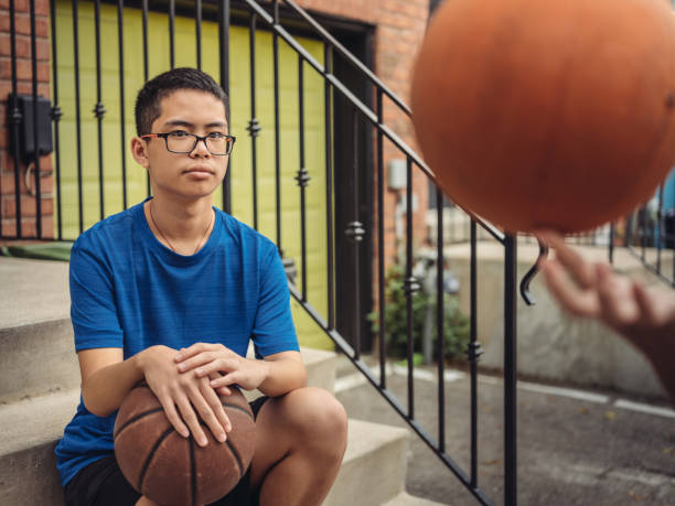 istock Twins at basketball 1035130302