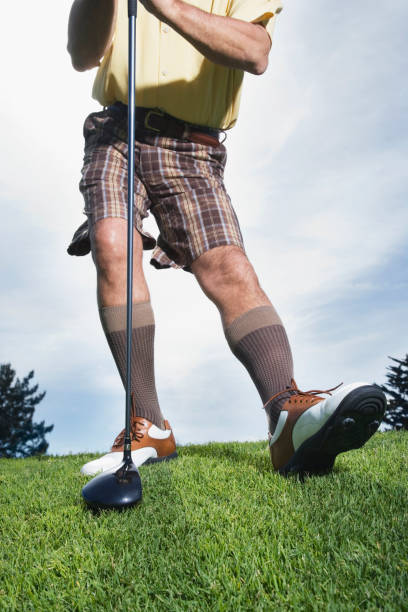 istock Man holding golf club and stretching 1035130370